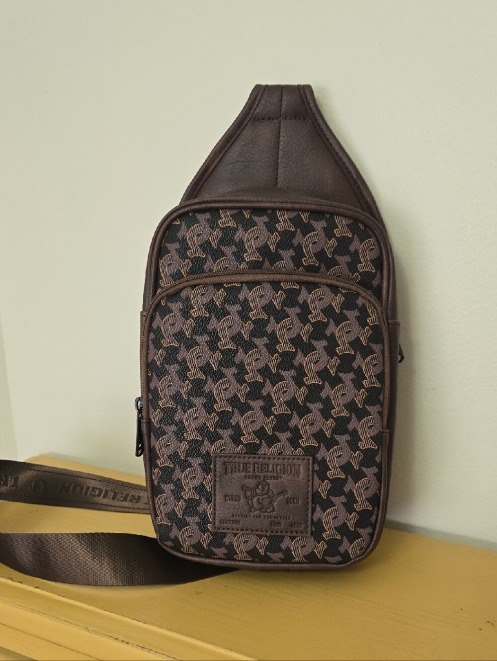 True Religion Brown Monogram Sling Bag. NWT.